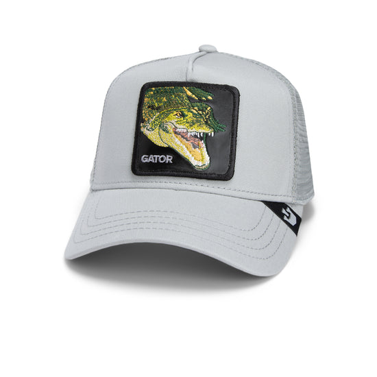 Hellgraue Trucker-Cap mit schwarzem Patch und grünem alligatorartigen Krokodilkopf-Motiv.